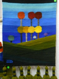 Wandbehang mit einem grafisch
                              dargestellten Strand mit farbigen Bumen
                              02