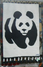 Wandteppich mit einem Panda-Br in
                            Schwarz-Weiss (WWF-Symbol)